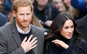 Prince Harry and Meghan Markle arrive at the Esplanade in front of the Edinburgh Castle in Edinburgh, on February 13, 2018, on their first official joint visit to Scotland.