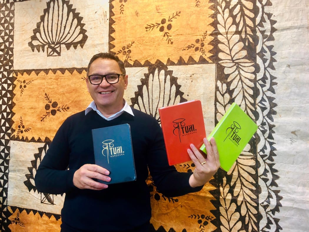Donn Mann showcasing some Maori stationary