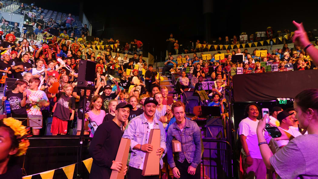 Six60 pose for selfies at the Ukelele festival.