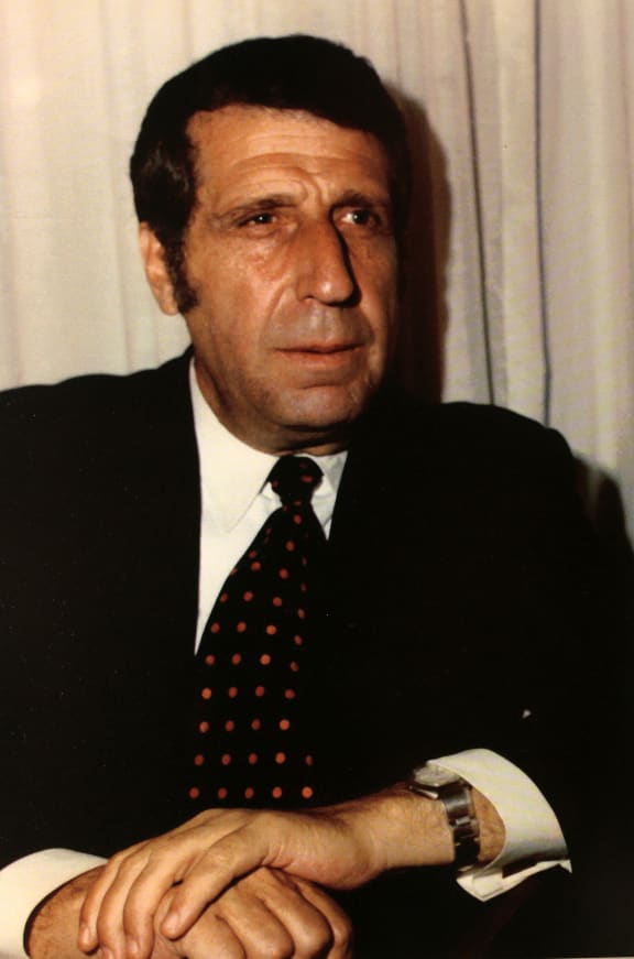 headshot of composer Arno Babajanian in suit and tie