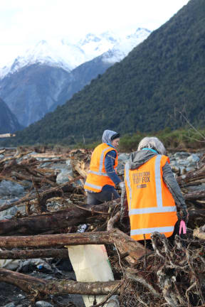 Volunteers pick up rubbish where a disused Fox River landfill spilled litter on the West Coast.