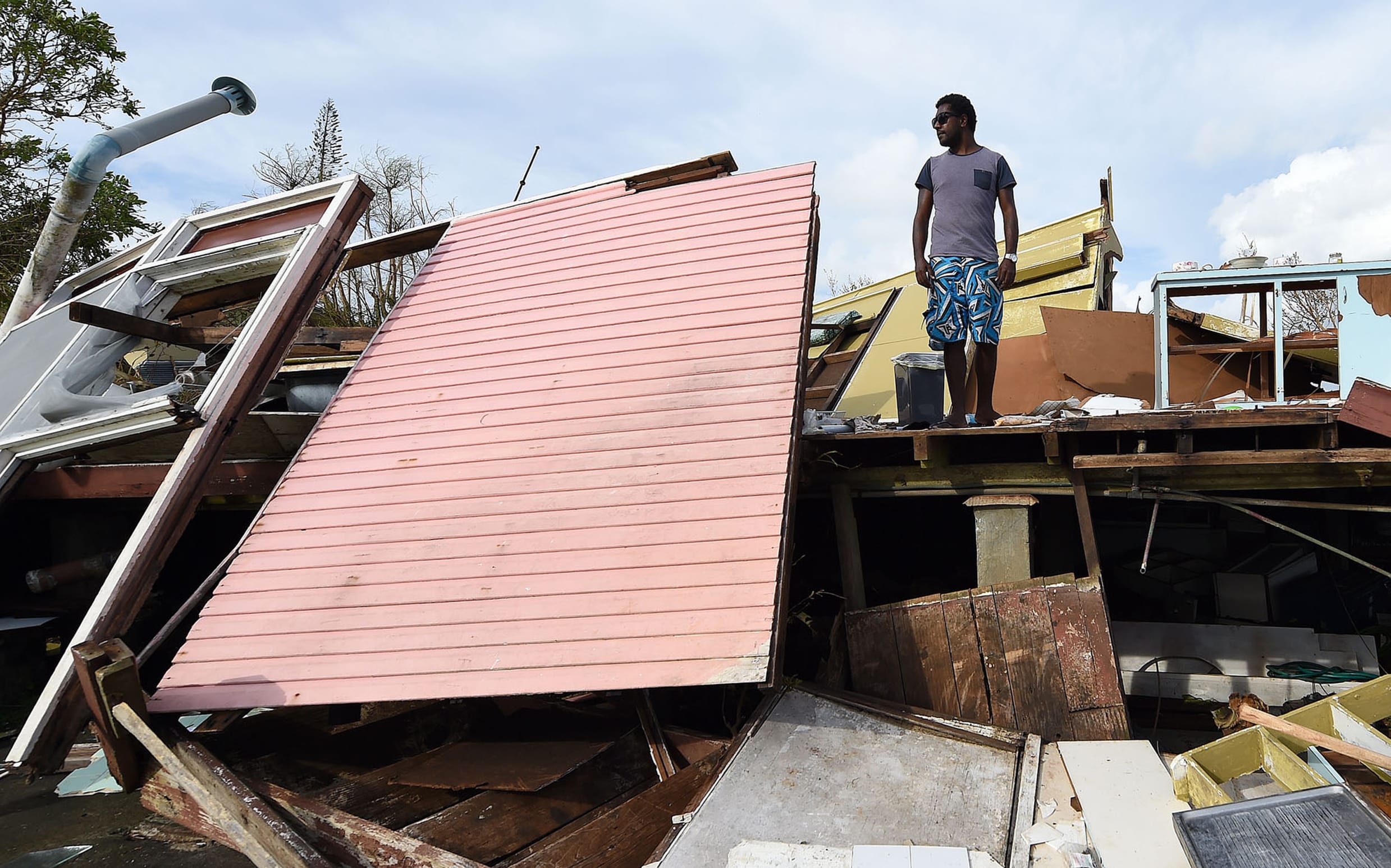 Adrian Banga surveys his shattered Port Vila house.