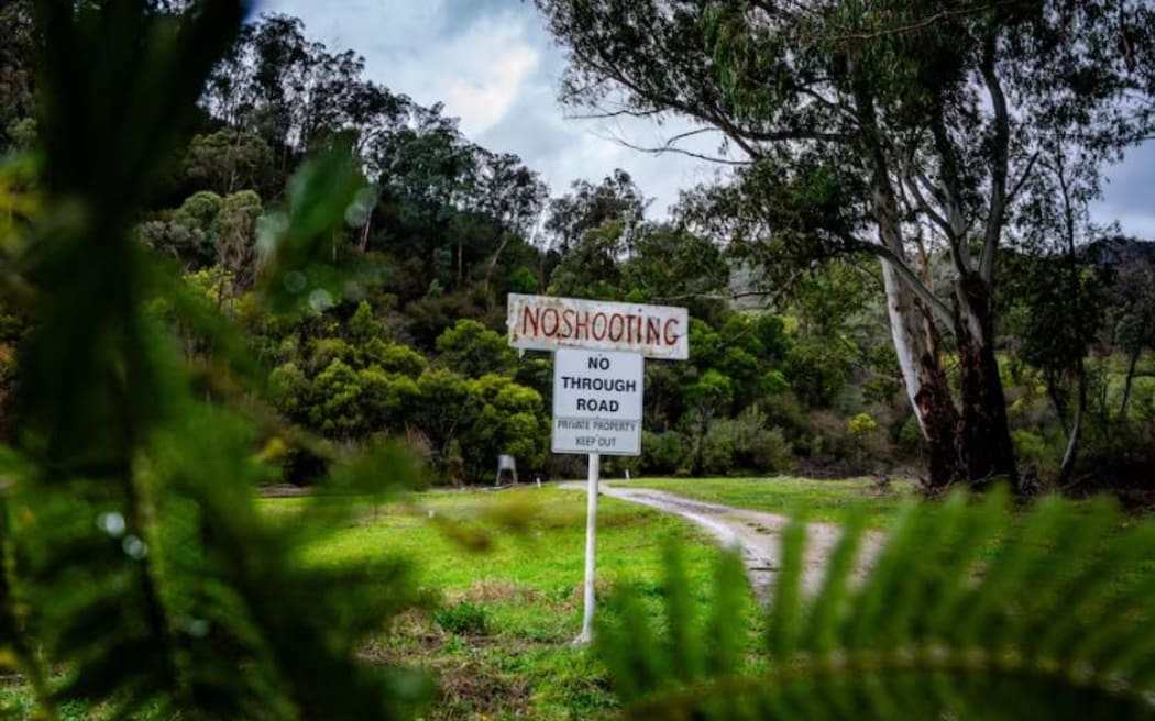 A "no shooting" and "private property" sign marks the end of the road nearby Dezi Freeman's previous address.