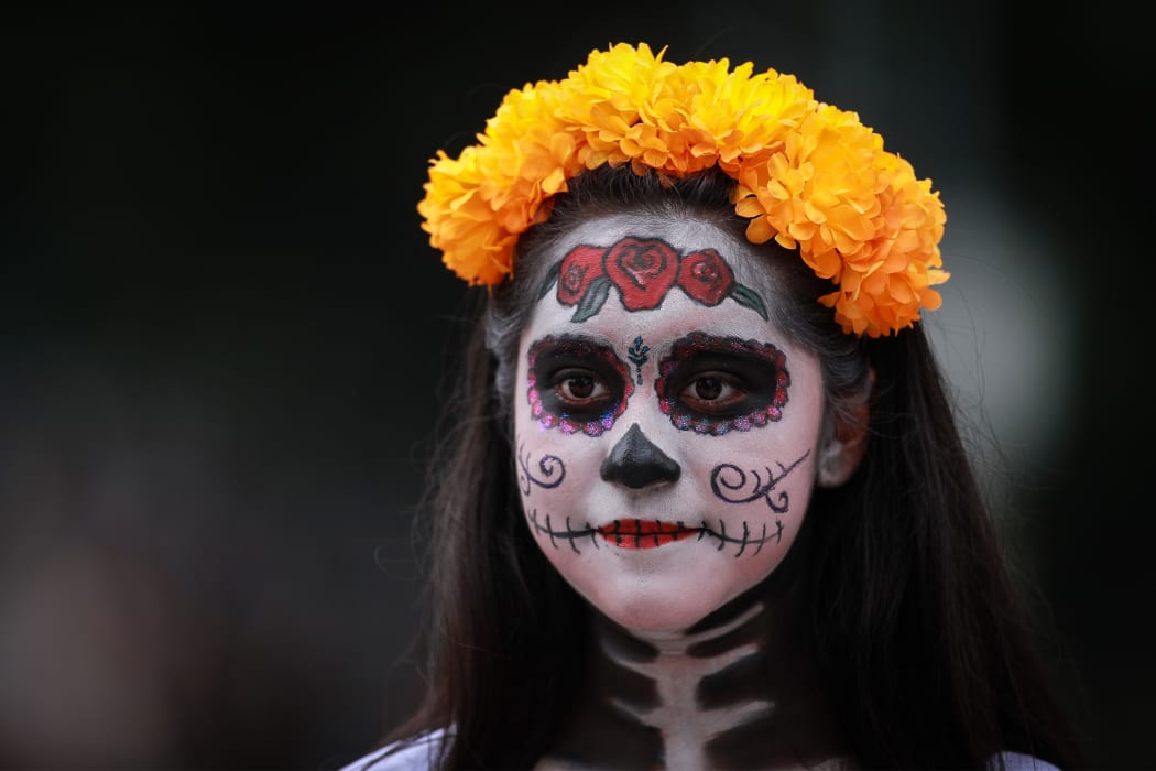 A woman dressed as Catrina - Mexico's skeleton lady – in Mexico City on 23 October, a few days before the Day of the Dead celebrations.
