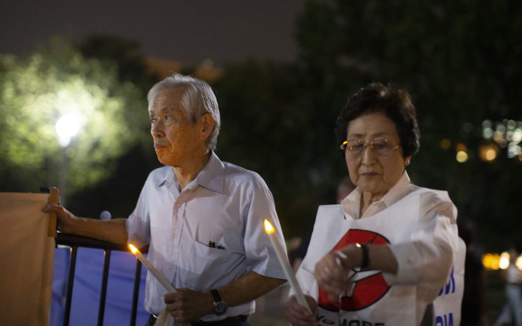 Michiko Kodama (right) at a Candlelight Vigil in Washington DC, marking the nuclear bombing of Nagasaki, on 8 August, 2019.