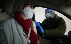 Huston resident, Rosemary receives her second Moderna vaccination at a drive-through facility near Houston, Texas
