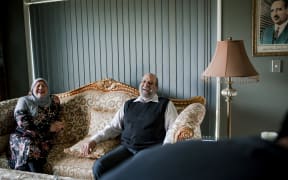 Mayssaa and her husband Mahmud laughing during an interview at their home in Kirikiriroa