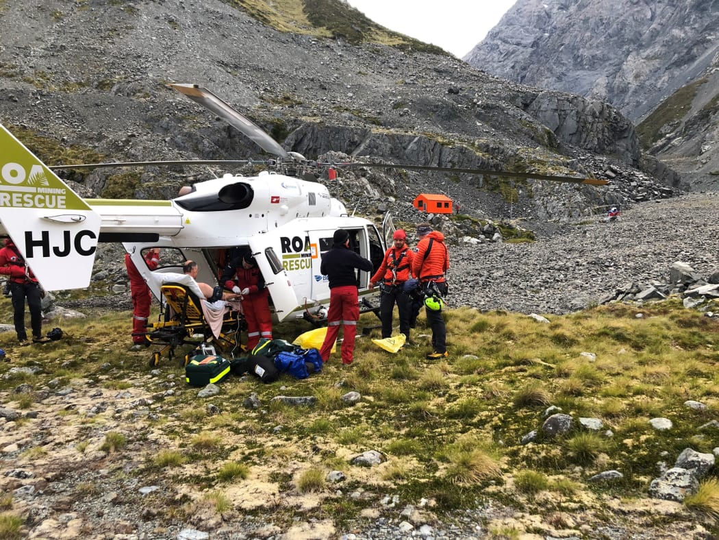The injured climber being loaded on to the helicopter