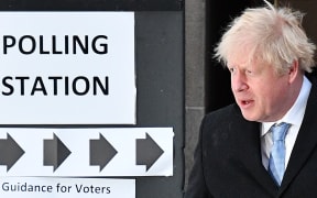Boris Johnson leaves from a polling station after voting
