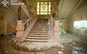 In this handout photograph taken and released by the Ukrainian Emergency Service on January 31, 2025, shows damages inside a hotel building following Russian missile strike in Odesa. A Russian missile attack struck the centre of the southern Ukrainian city of Odesa on January 31, 2025 evening, wounding two women and a teenage boy and damaging historic buildings, officials said. The Black Sea city known for its picturesque streets of 19th-century buildings is regularly targeted by Russian strikes, often on its port area. (Photo by Handout / UKRAINIAN EMERGENCY SERVICE / AFP) / XGTY / RESTRICTED TO EDITORIAL USE - MANDATORY CREDIT "AFP PHOTO /  UKRAINIAN EMERGENCY SERVICE" - NO MARKETING NO ADVERTISING CAMPAIGNS - DISTRIBUTED AS A SERVICE TO CLIENTS