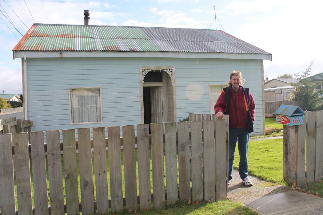 A photo of Andrew Williamson in front of his Milton home.