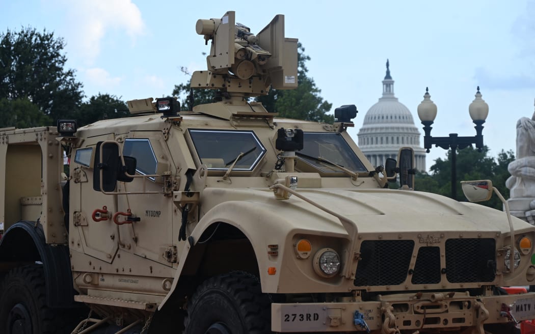 A military vehicle parks outside of Union Station, a major transportation hub, with the United States Capitol visible in the background in Washington, D.C., United States, on August 15, 2025. The patrols by the National Guard are part of President Donald Trump's crime reduction plan for the District of Columbia. (Photo by Kyle Mazza/NurPhoto) (Photo by KYLE MAZZA / NurPhoto via AFP)