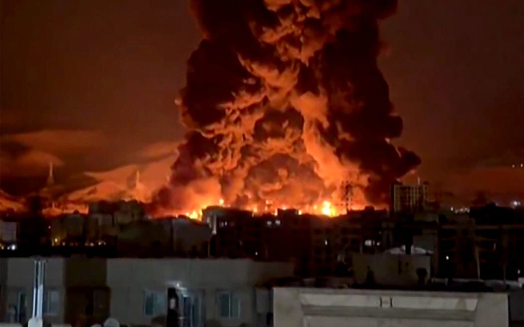 This video grab taken from UGC images posted on social media on 7 and 8 March, 2026 shows fire erupting at an oil depot in Iran's capital Tehran.