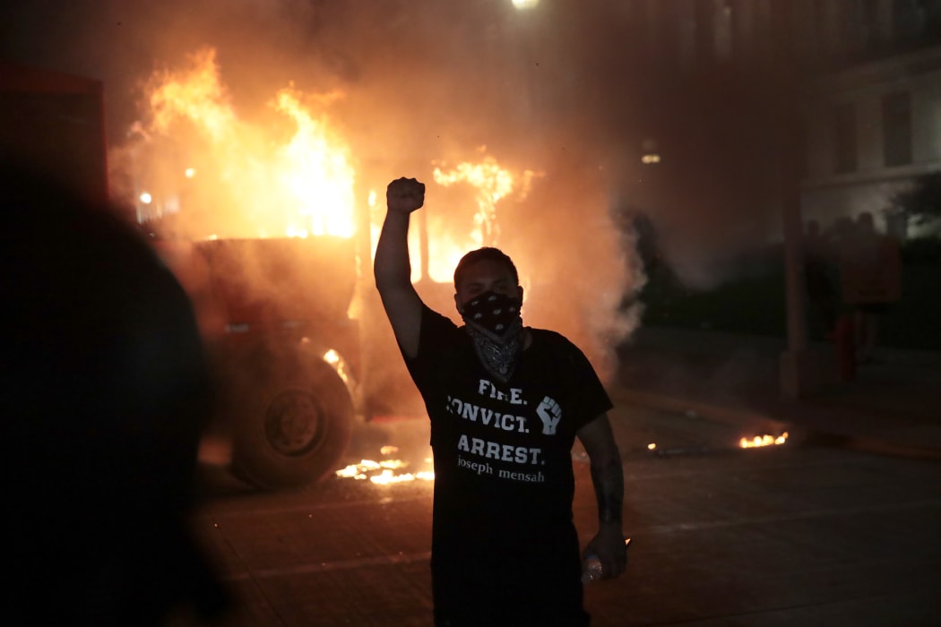 Fires burn around downtown Wisconsin during a second night of rioting