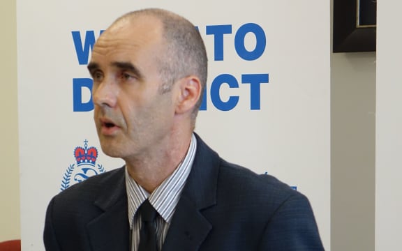 Detective Sergeant Nick O'Brien at the police news conference today.