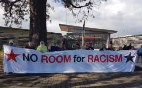 Protesters outside the Gisborne District Council want to make sure the conversation doesn't die down.