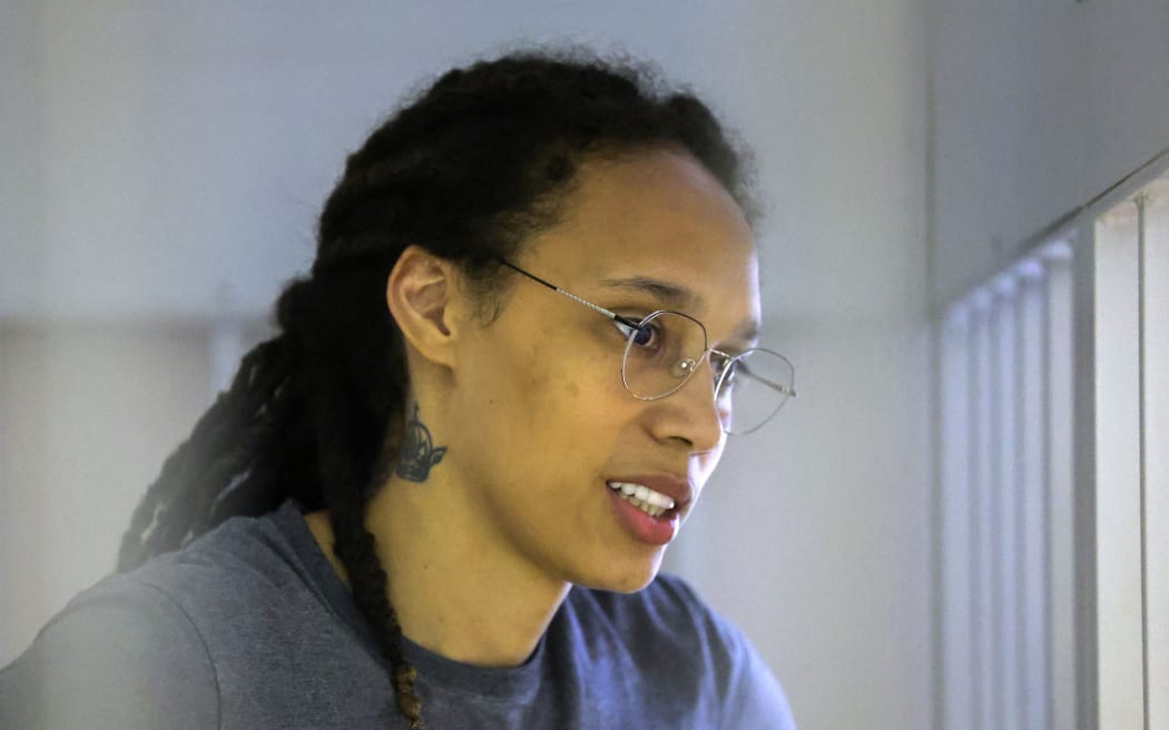 US basketball player Brittney Griner, who was detained at Moscow's Sheremetyevo airport and later charged with illegal possession of cannabis, waits for the verdict inside a defendants' cage during a hearing in Khimki outside Moscow, on 4 August, 2022.