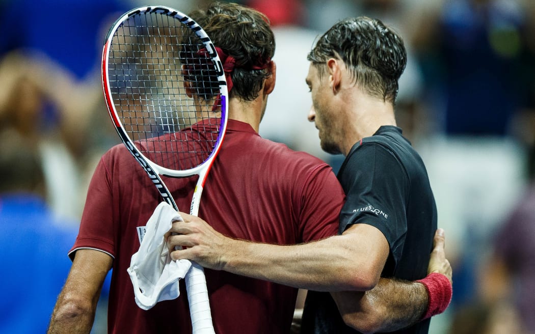 Roger Federer (left) congratulate Australian John Millman after his upset win over the Swiss maestro at the US Open.