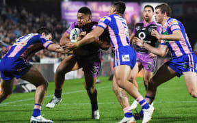 Warriors winger David Fusitu'a crashes over for a tray against Newscastle.