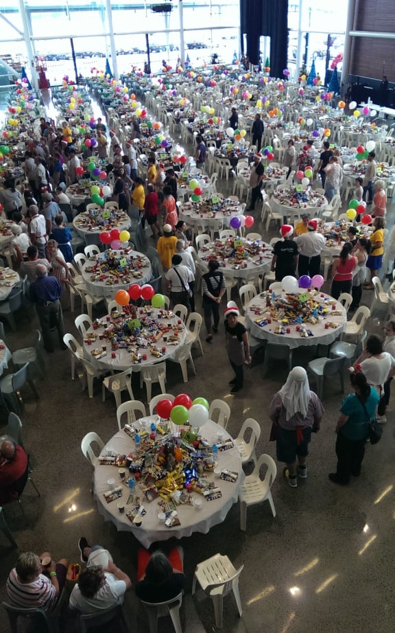 Tables are readied for the Auckland City Mission lunch.