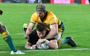 All Blacks Beauden Barrett scores a try with Australia's David Pocock during the 2nd All Black vs Australia Bledisloe Cup rugby match.
