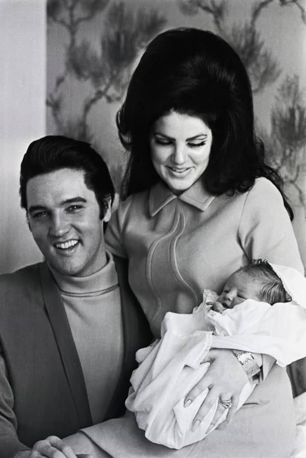 Memphis, Tenn: A very happy Elvis Presley prepares to join his wife, Priscilla Beaulieu Presley, and four-day-old daughter, Lisa Marie, as they leave Baptist Hospital here. Lisa Marie is the Presley's first child.