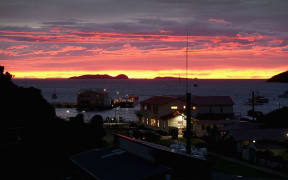 Sunrise over the Southsea Hotel in Oban, Stewart Island, in May 2015.