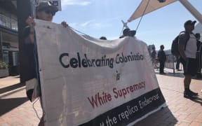 Protesters have disrupted the Wellington event in the Tuia 250 commemorations, calling for a boycott of the replica Endeavour ship.