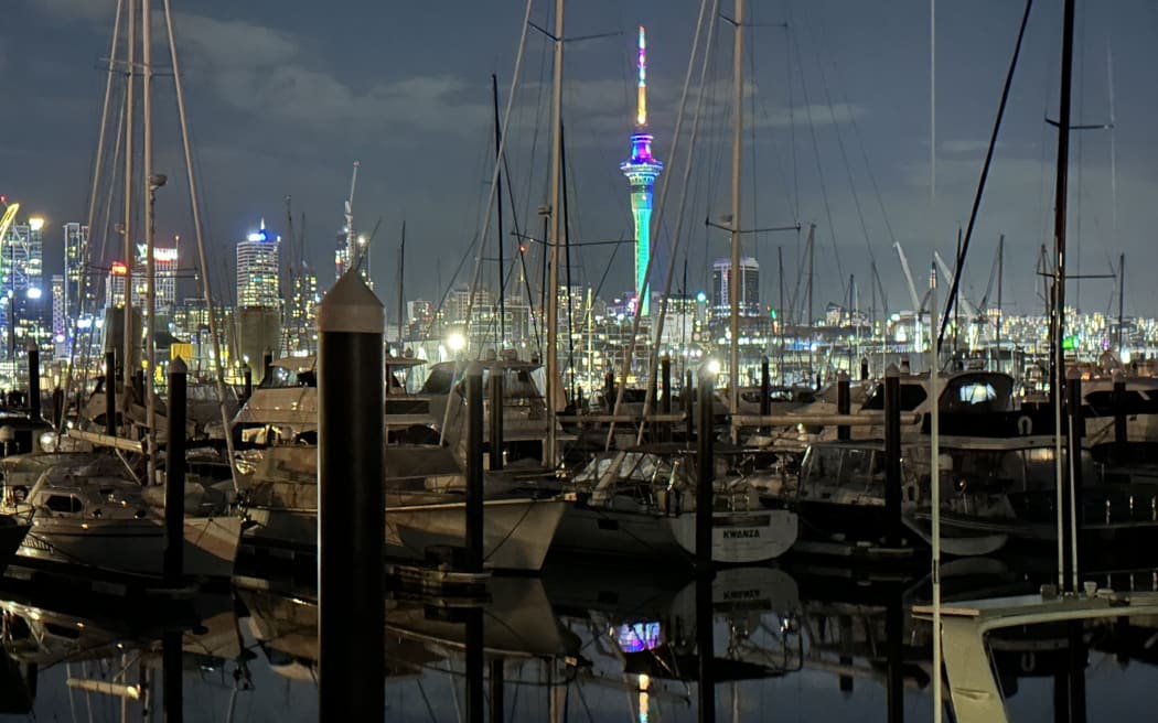 rainbow Sky Tower Auckland, from Westhaven marina, Feb 18, 2024.