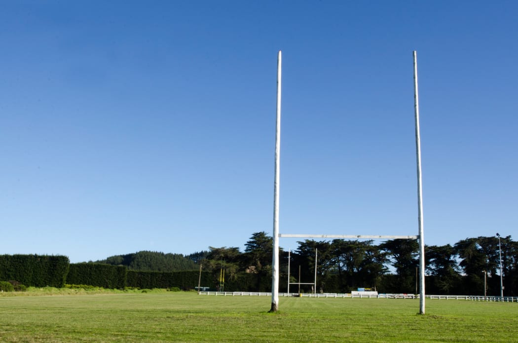Goal posts for football, rugby union or league on field. Concept photo of sport, achievement mission and goals.