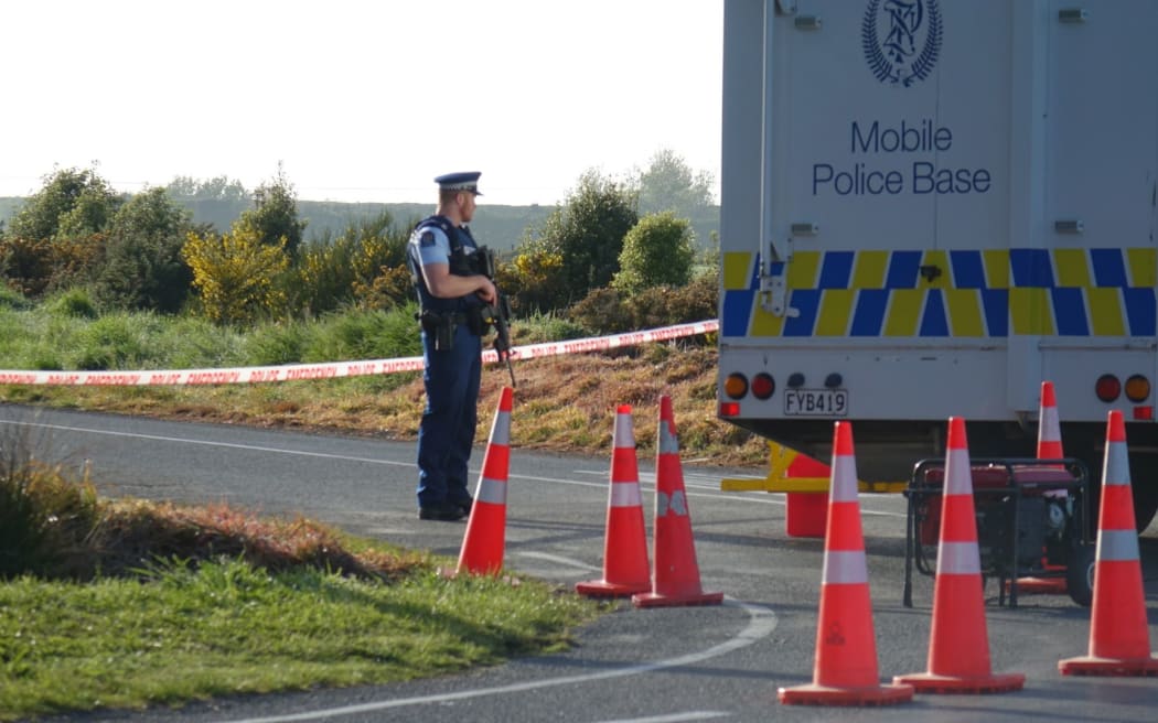 A police officer on Monday morning at a cordon near the scene of the fatal shooting in Charing Cross.
