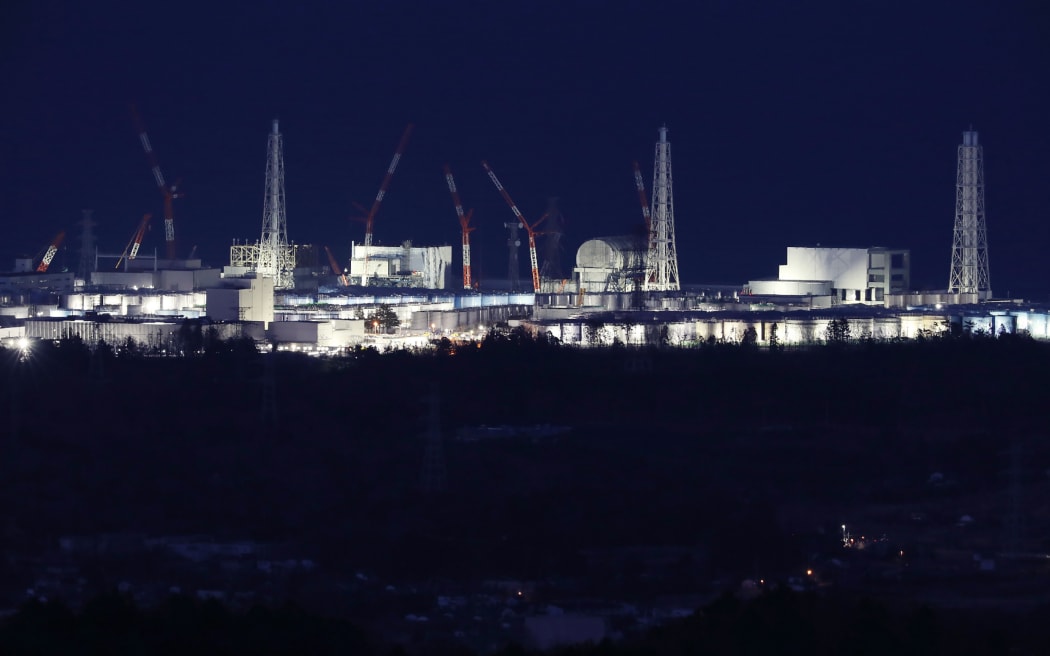 Fukushima Daiichi nuclear power plant  lit up in Okuma.