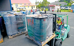 The drums are loaded on to a truck in Gisborne prior to being transported to Auckland for shipment.