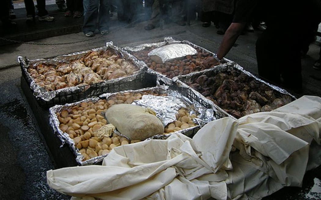 A hāngi is prepared for tourists at Mitai Maori Village, Rotorua.