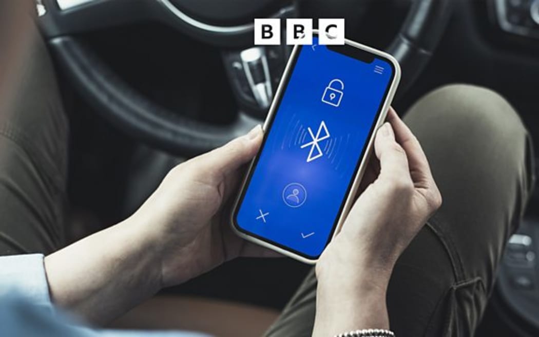 A mobile phone with the Bluetooth logo.
