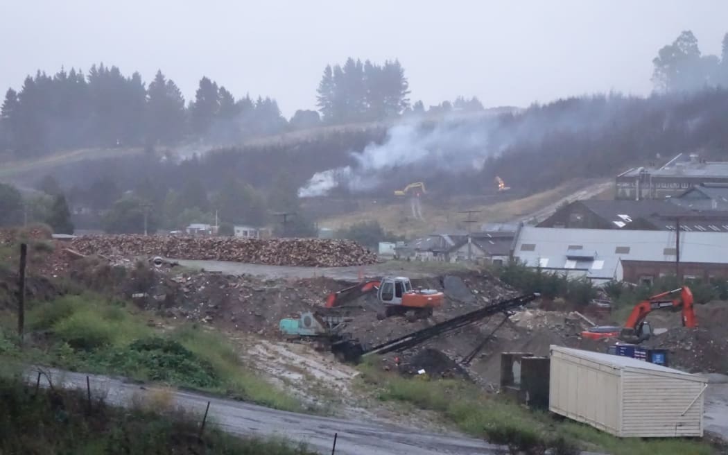The smouldering fire in the Dunedin suburb of Burnside.