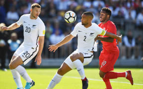 New Zealand's WInston Reid and Peru's Jefferson Farfan.