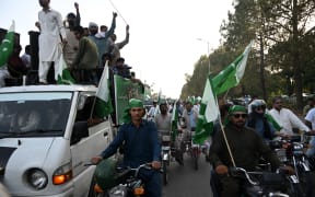 Demonstrators carrying Pakistan's national flags participate in an anti-India protest in Islamabad on May 10, 2025.