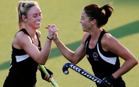 Krystal Forgesson of New Zealand celebrates her goal with Anita Punt. Glasgow 2014 Commonwealth Games. Hockey, Black Sticks Women v Trinidad and Tobago, July 2014.
