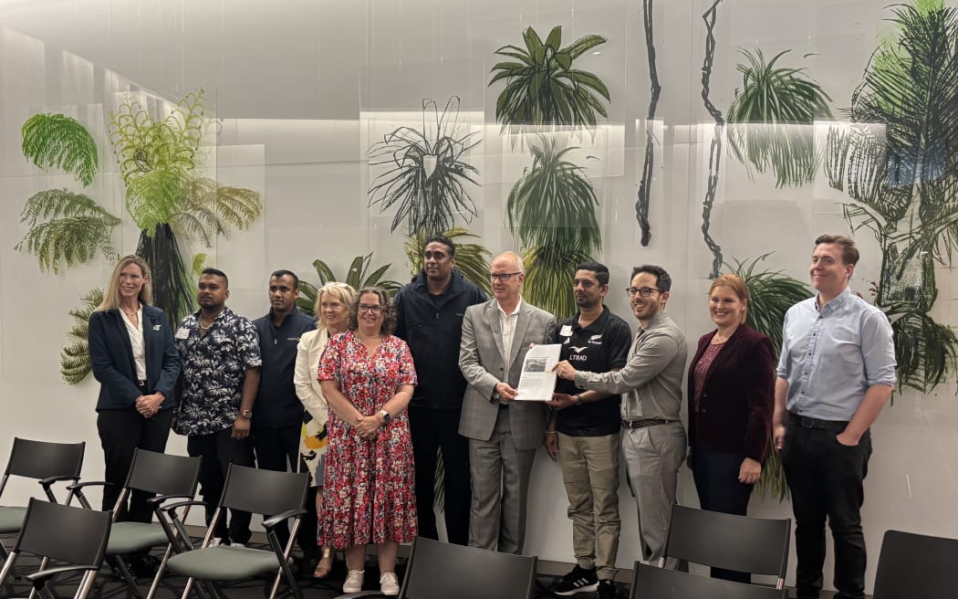 More than 500 bus drivers submitted a petition to Parliament on Tuesday, asking the government to lower the strict English-language requirement for residency.