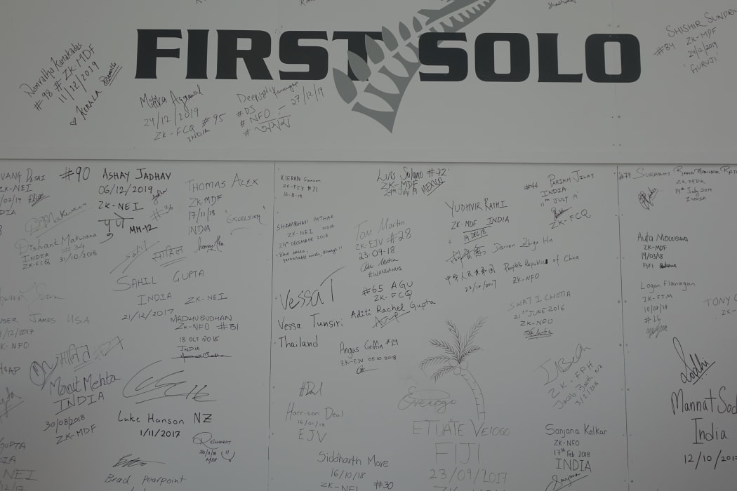 Students from around the world have left messages on a board at the New Zealand International Commercial Pilot Academy.