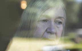 Close up worried senior woman at window. (Photo by CAIA IMAGE/SCIENCE PHOTO LIBRARY / NEW / Science Photo Library via AFP)
