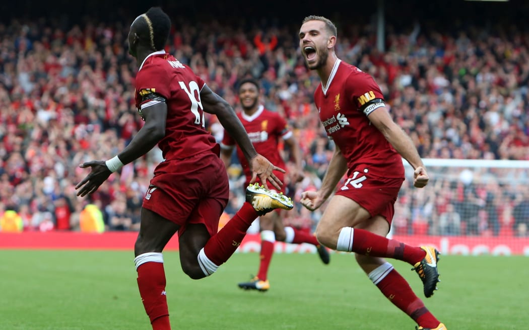 Liverpool's Sadio Mane (left) celebrates with Jordan Henderson