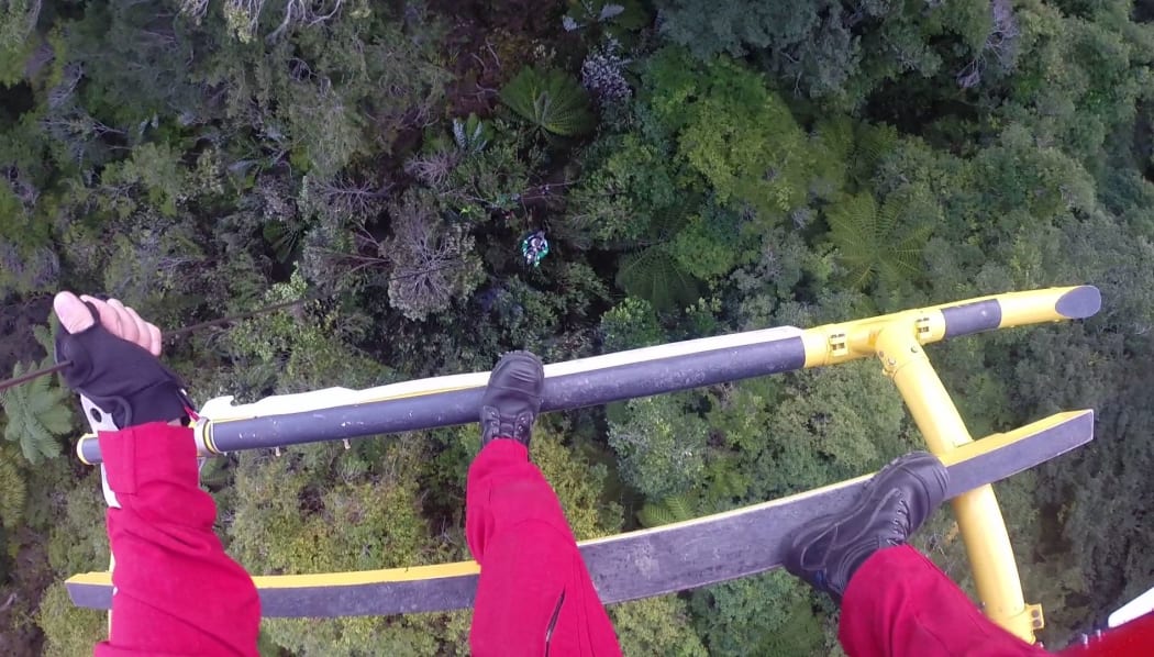 The paramedic was winched from about 36 metres above the track.