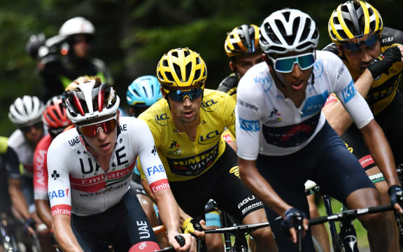 (From L) Team UAE Emirates rider Slovenia's Tadej Pogacar, Team Jumbo rider Slovenia's Primoz Roglic wearing the overall leader's yellow jersey and Team Ineos rider Colombia's Egan Bernal ride during the 13th stage of the 107th edition of the Tour de France.