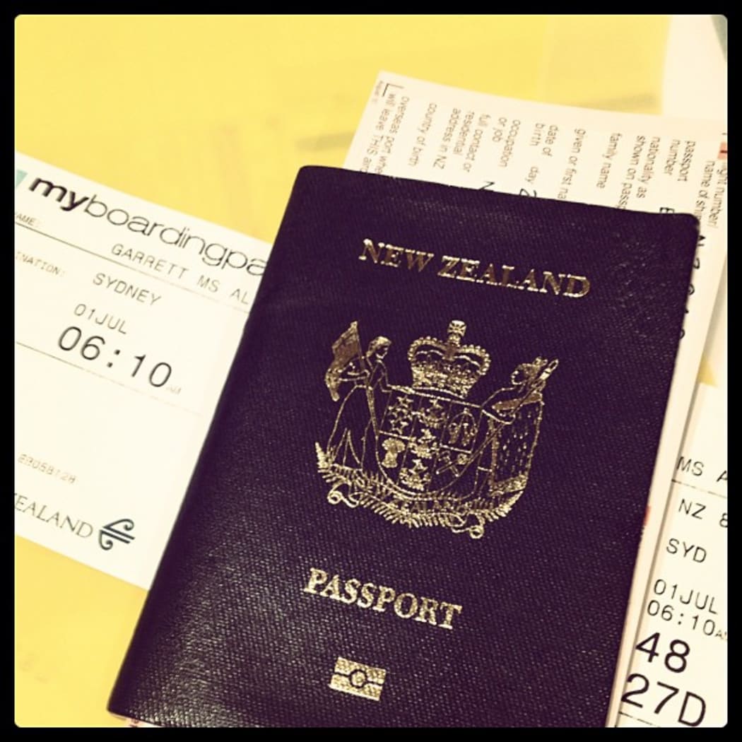 A photo of Ally's passport and boarding pass. Like a boss.