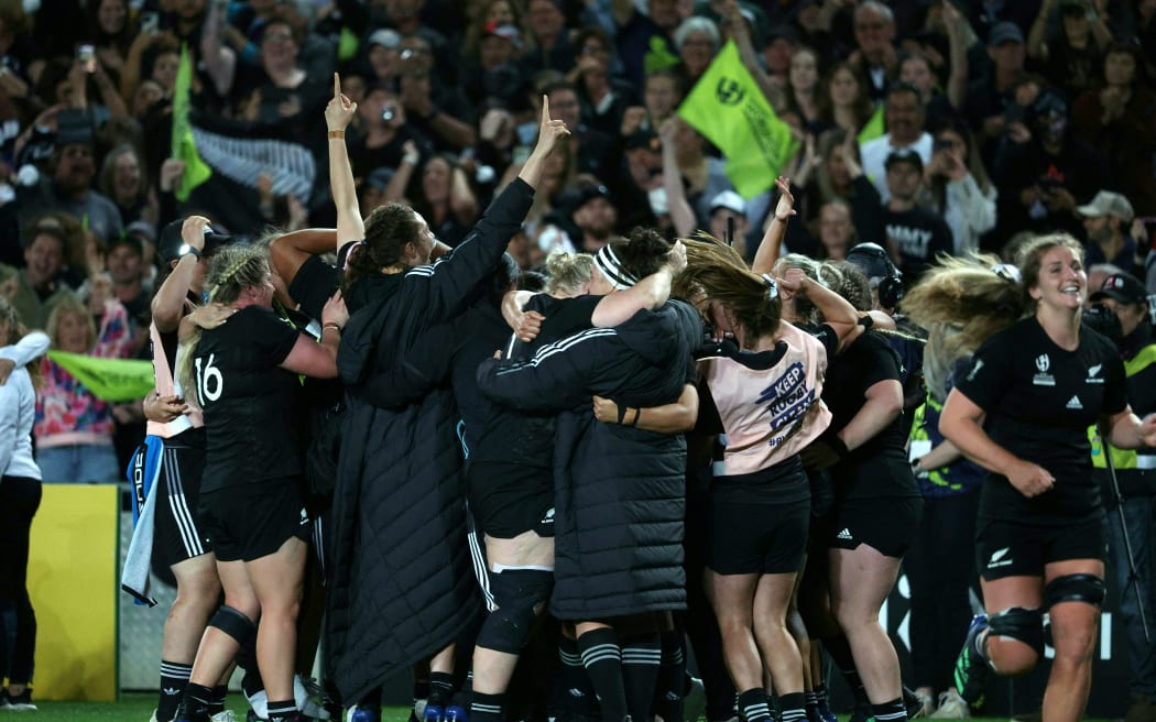 New Zealand's players celebrate after winning the Rugby World Cup final match between the Black Ferns and England at Eden Park in Auckland.