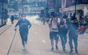 Police fire tear gas on protesters during a planned protests against a proposal to enact a new security legislation in Hong Kong on May 24, 2020.
