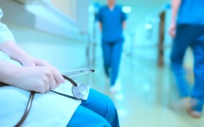 Doctor in hospital corridor