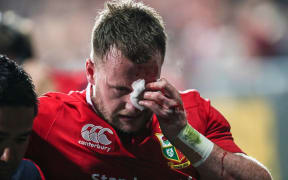 Lions fullback Stuart Hogg leaves the field injured against the Crusaders.